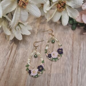 Roses in gold oval frame with green pearl