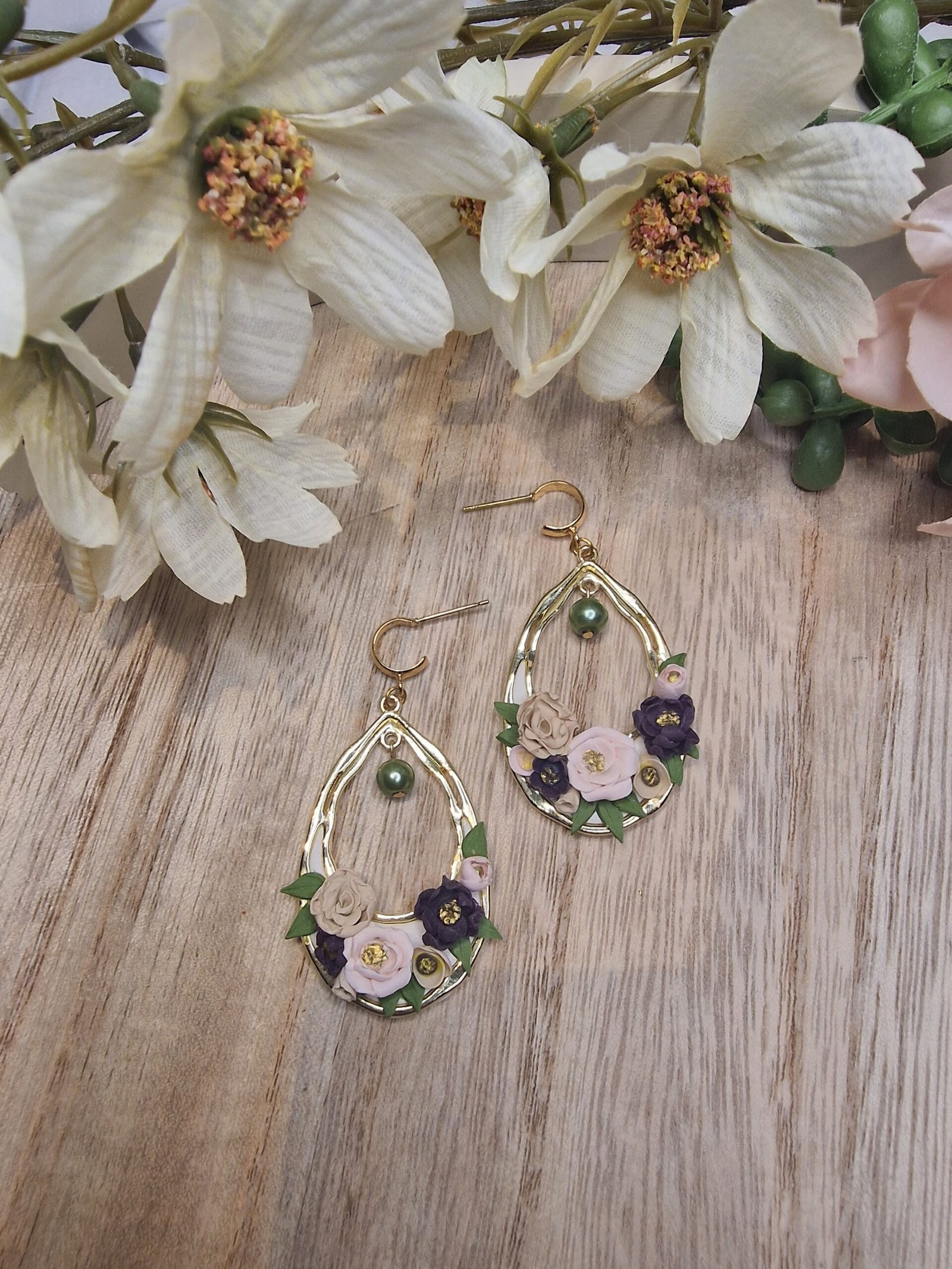 Roses in gold oval frame with green pearl
